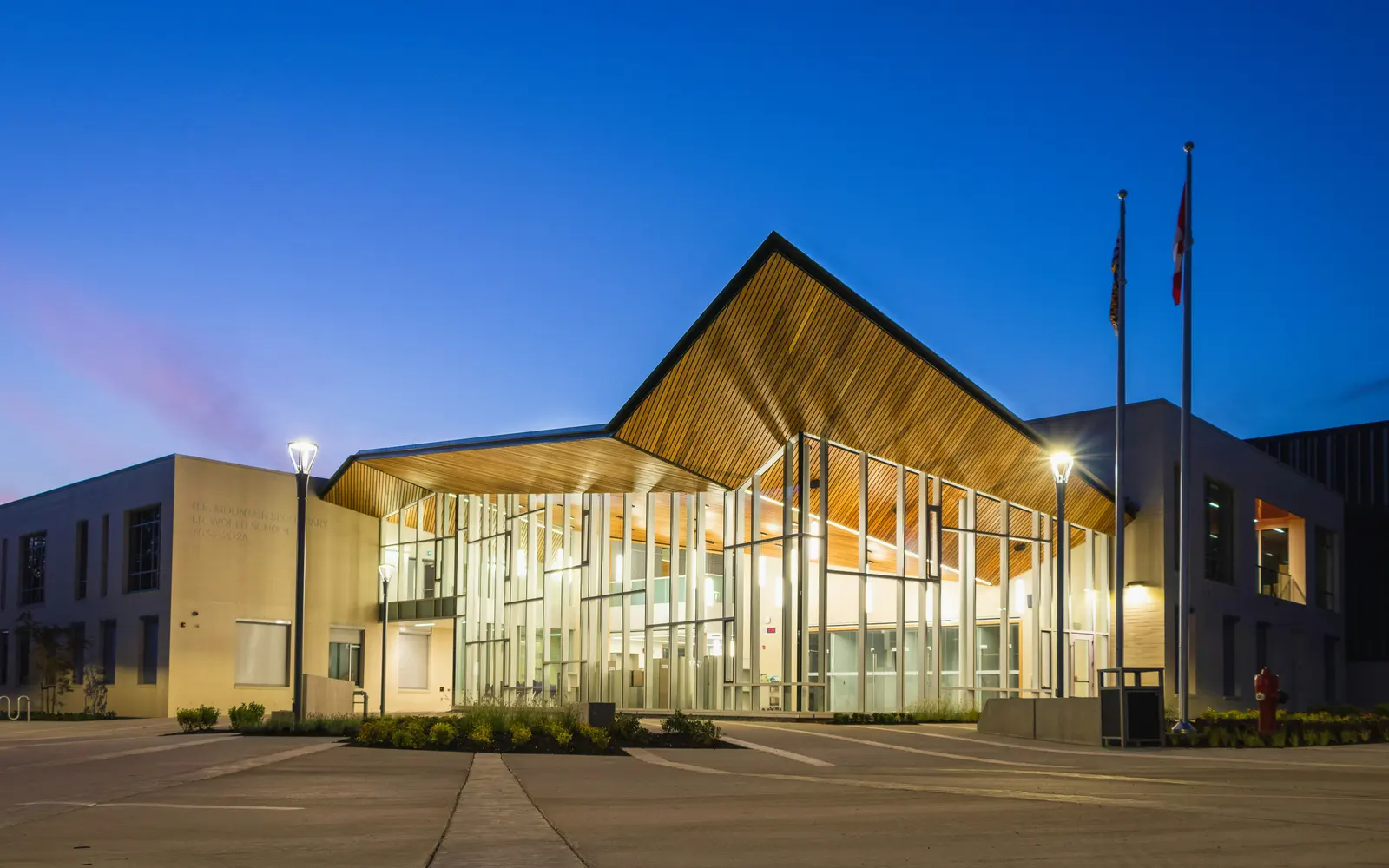 A K-12 school entrance lit at dusk